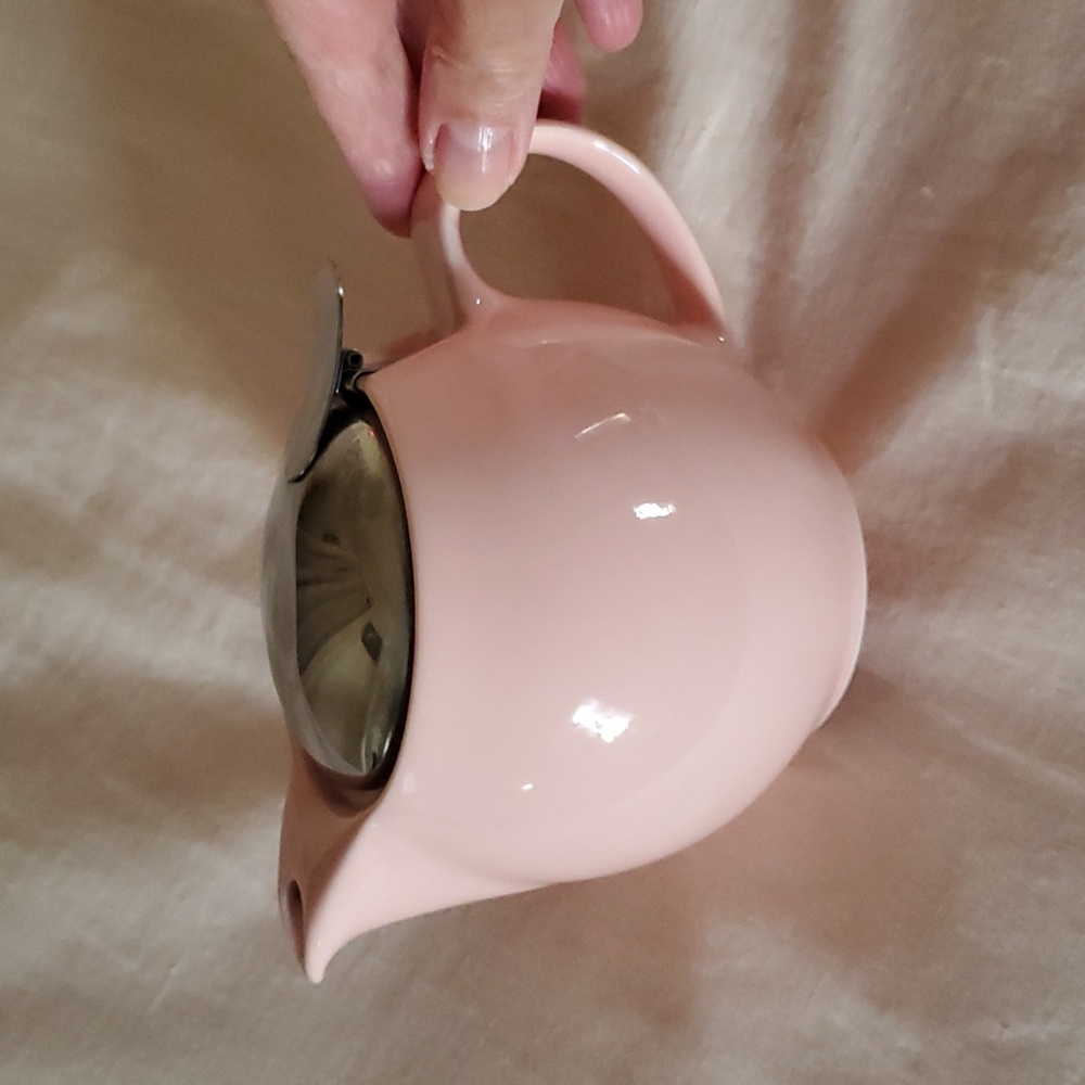 Pink ceramic teapot.